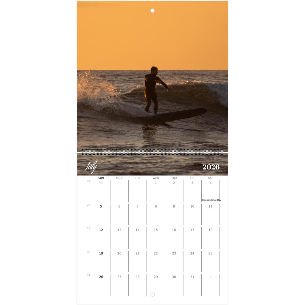 Coastal wall calendar shown in a styled room